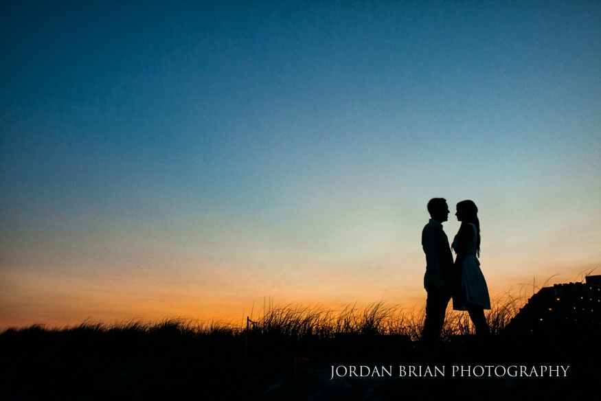 Rebecca and Mat silhouetted at golden hour sunset during Wildwood engagement session