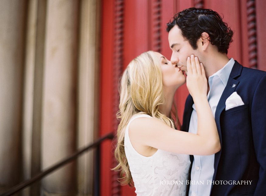 Rebecca and Nick laughing together during their Rittenhouse Square engagement photographs