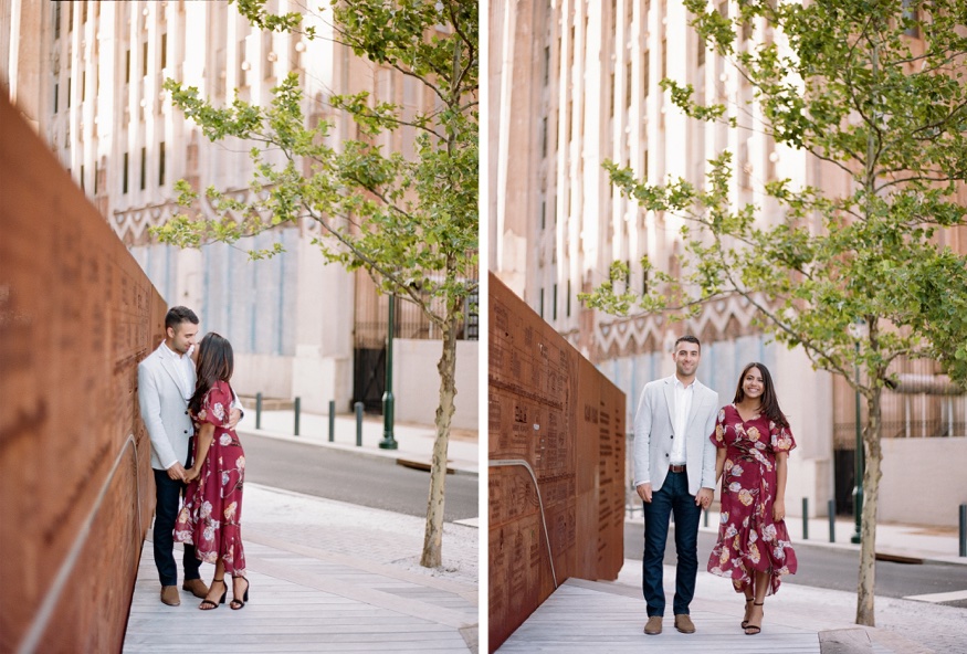 Roma and Eric posing in front of the rusted metal relief map sculpture at The Rail Park, Philadelphia.