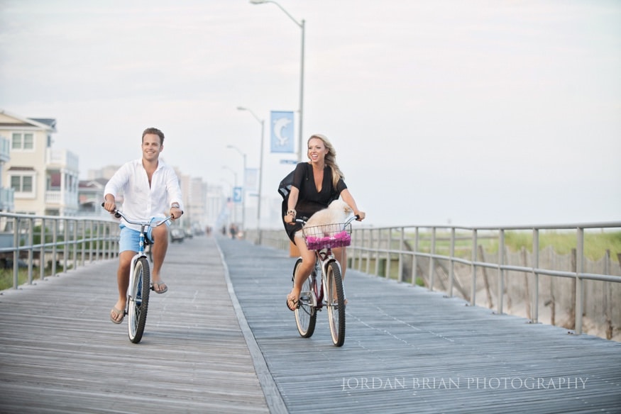 Simona and Brandon in evening attire at the bayside pier, Ventnor NJ engagement