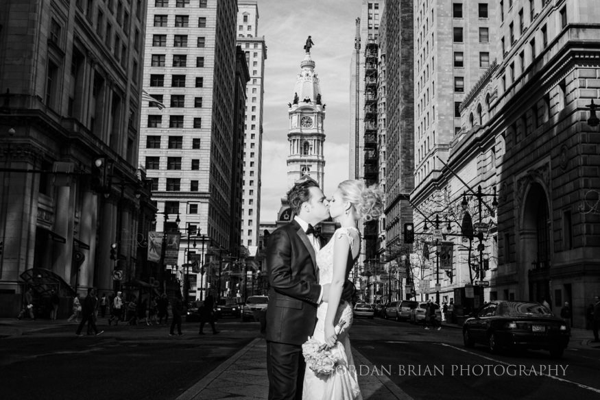 bride and groom portraits infront of city hall before curtis center wedding