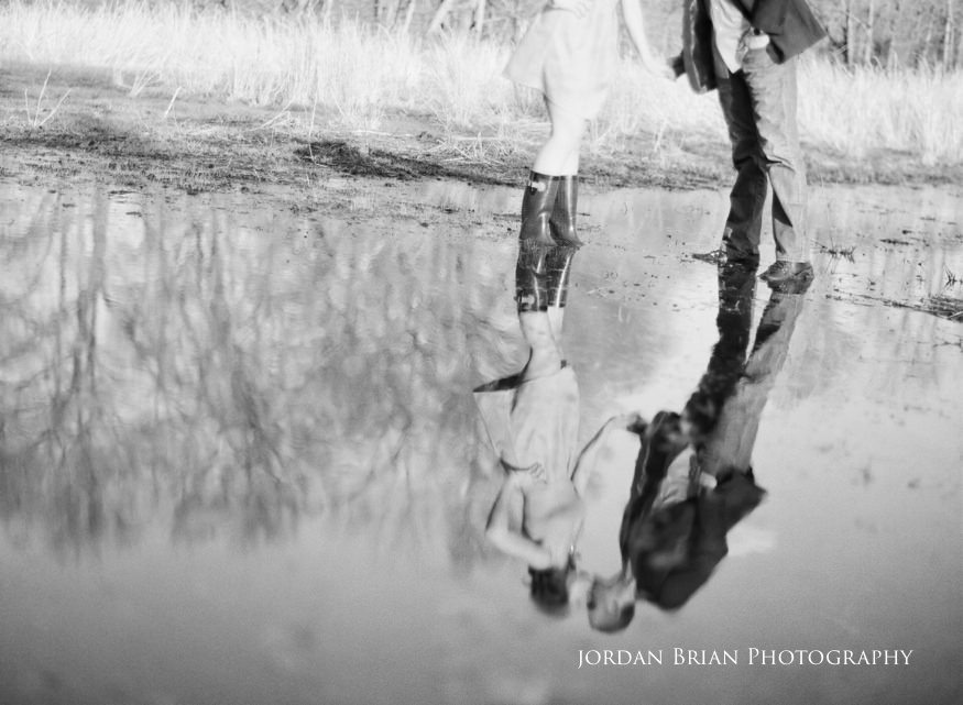 Close engagement portrait of Tara and Paul at the rustic barn