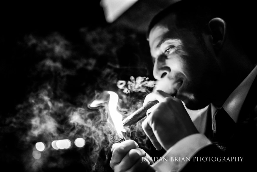 groom smoking a cigar