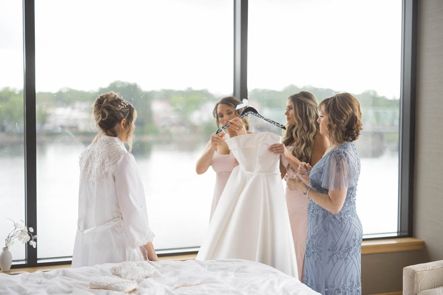 Bride putting on earrings Lambertville Inn wedding