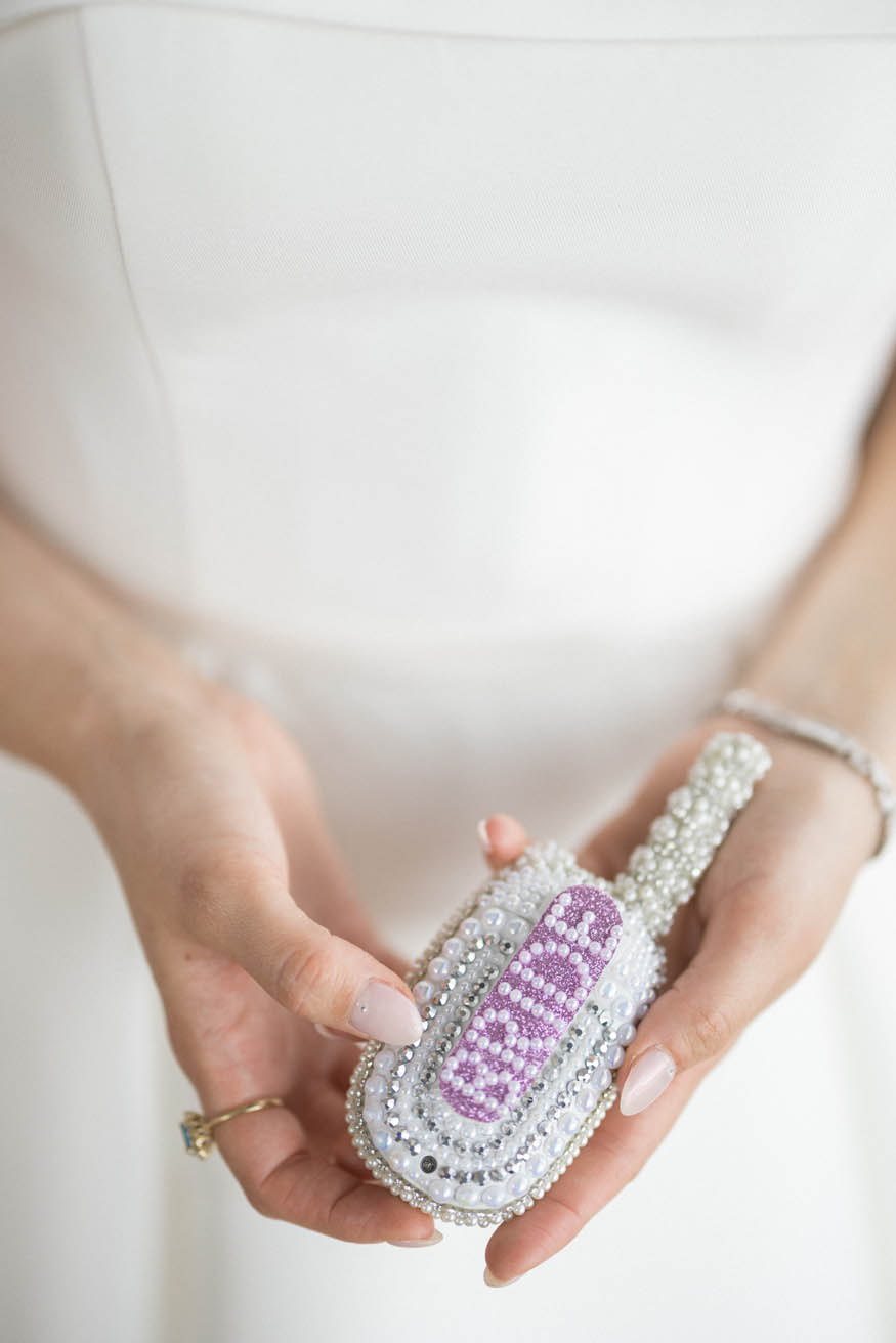 Bride putting on shoes Lambertville Inn wedding
