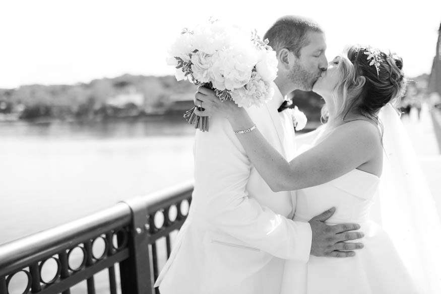 Couple kissing on bridge Lambertville Inn wedding