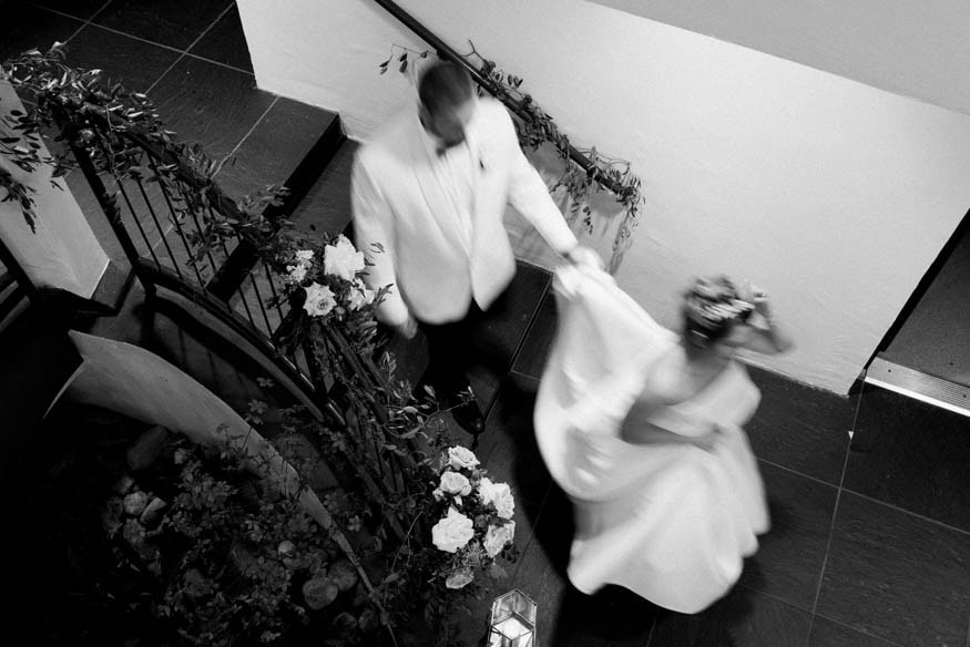 Bride and groom walking down stairs Lambertville Inn