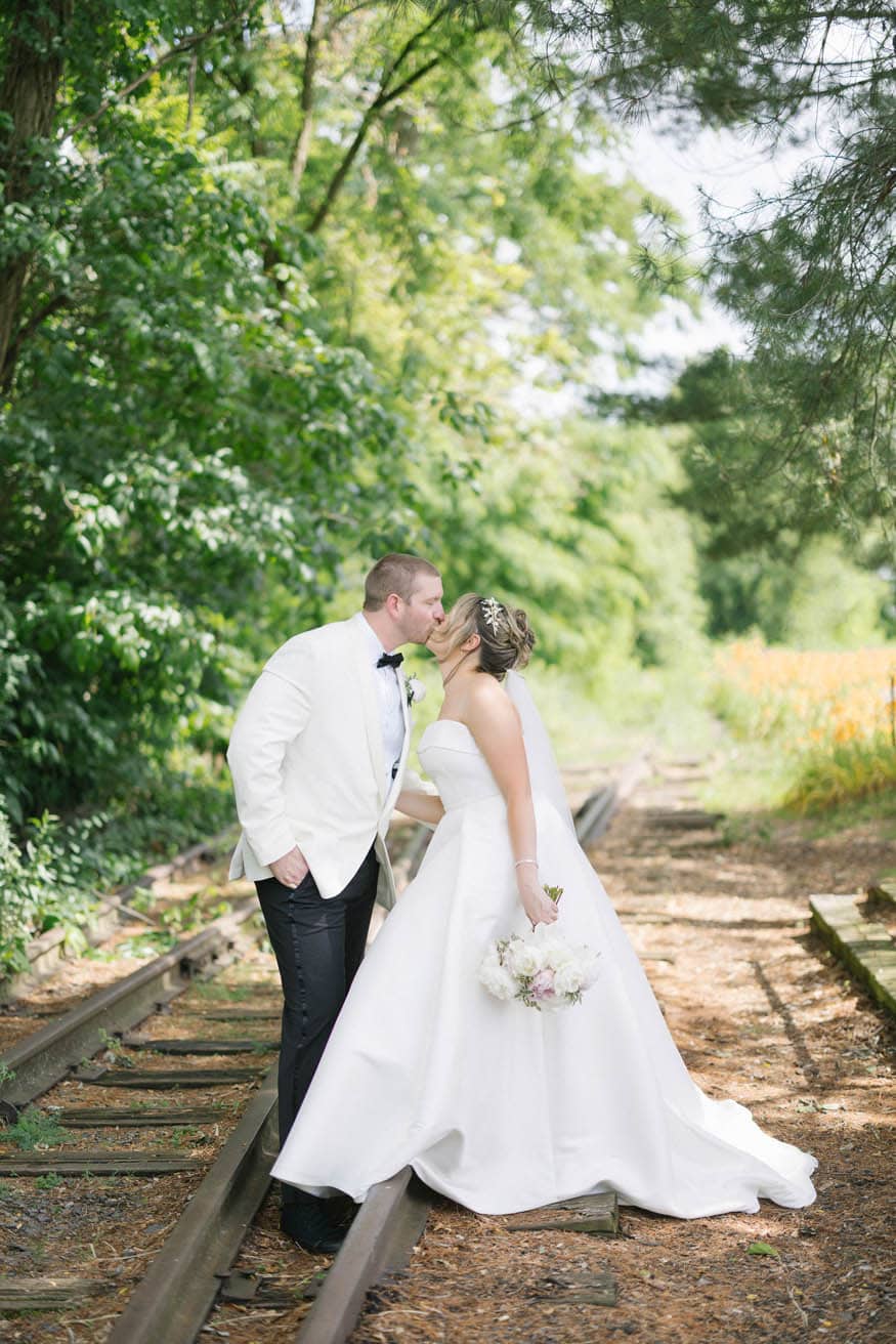 Bride Groom Kissing Traintracks Lambertville Inn Wedding