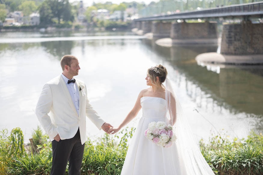 Bride and groom gazing at each other Lambertville bridge