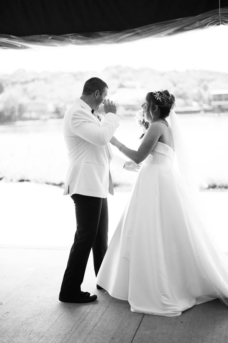 Couple embrace during first look Lambertville Inn