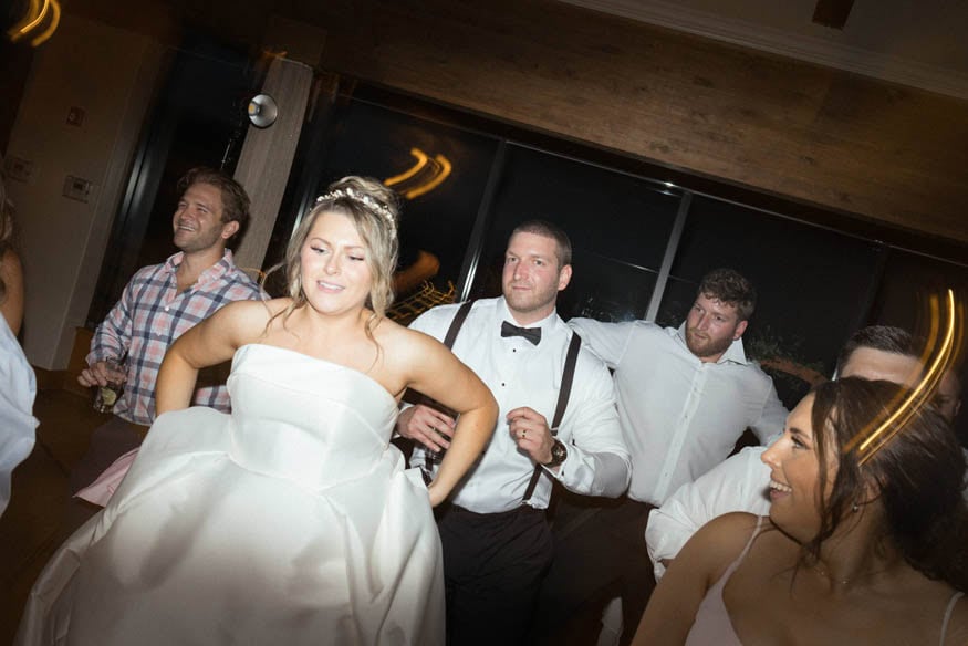 Bride holding dress dancing Lambertville Inn reception