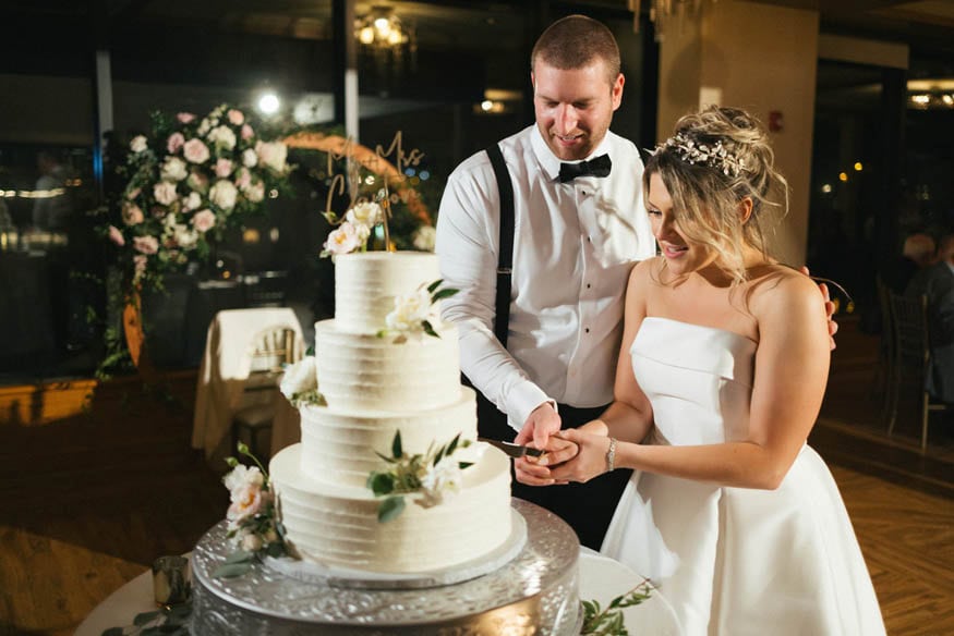 Bride and groom cake cutting Lambertville Inn wedding