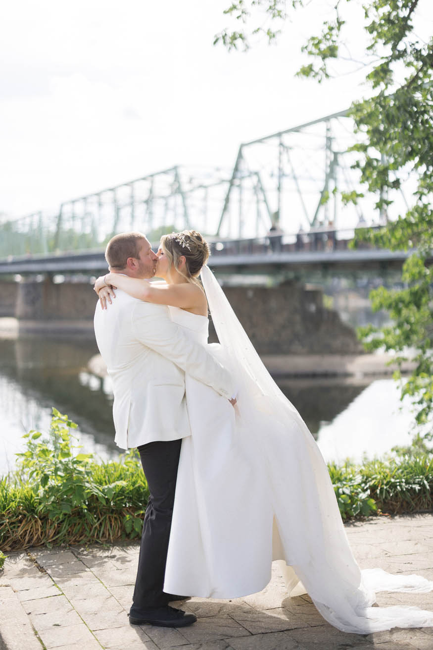 Romantic kiss on Lambertville bridge NJ wedding