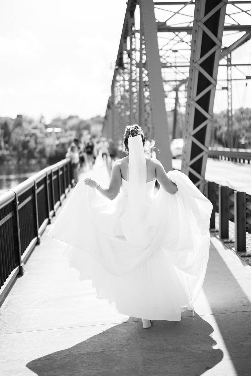 Bride walking away portrait on Lambertville bridge