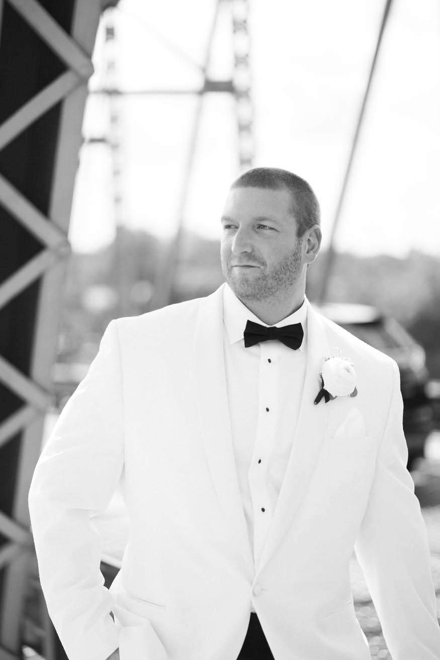 Groom portrait on bridge over Delaware River Lambertville