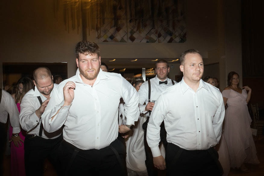 Groomsman walking at Lambertville Inn wedding reception
