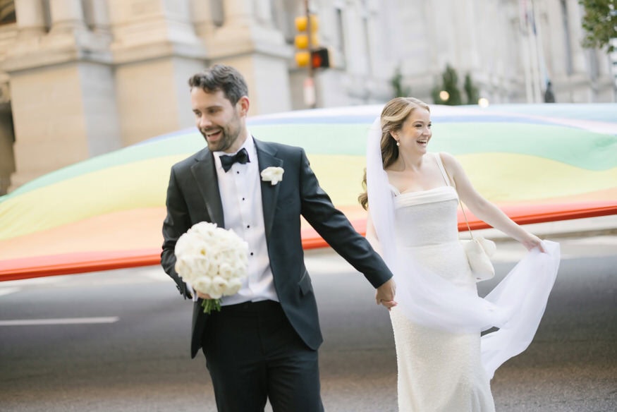 Bride and groom pride flag Philadelphia City Hall wedding