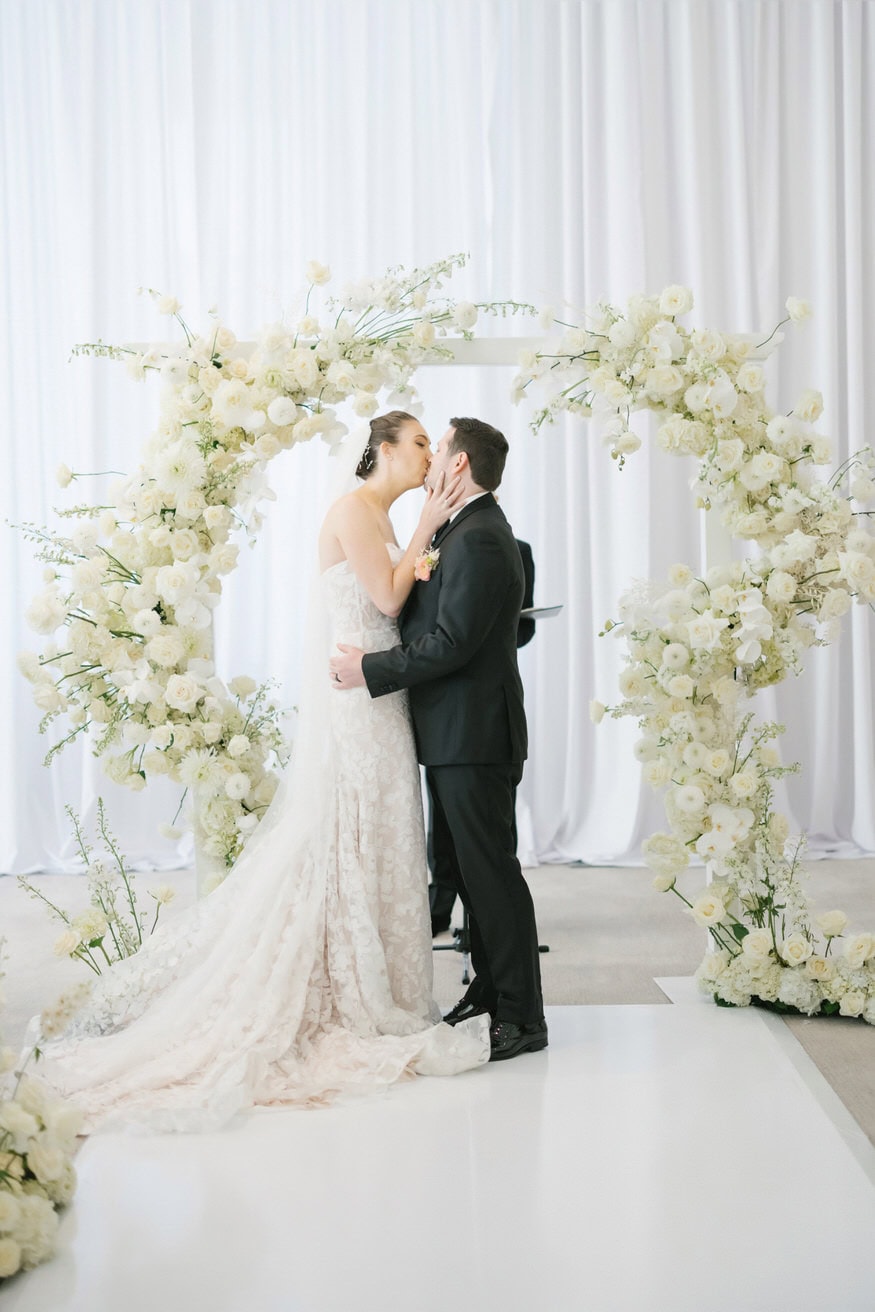 First kiss at Four Seasons Philadelphia wedding ceremony