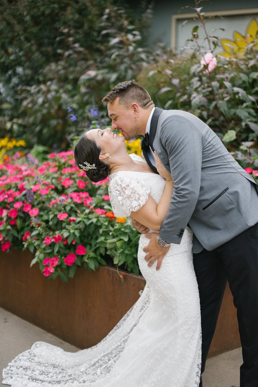 Romantic kiss in garden Valley Green Inn fall wedding