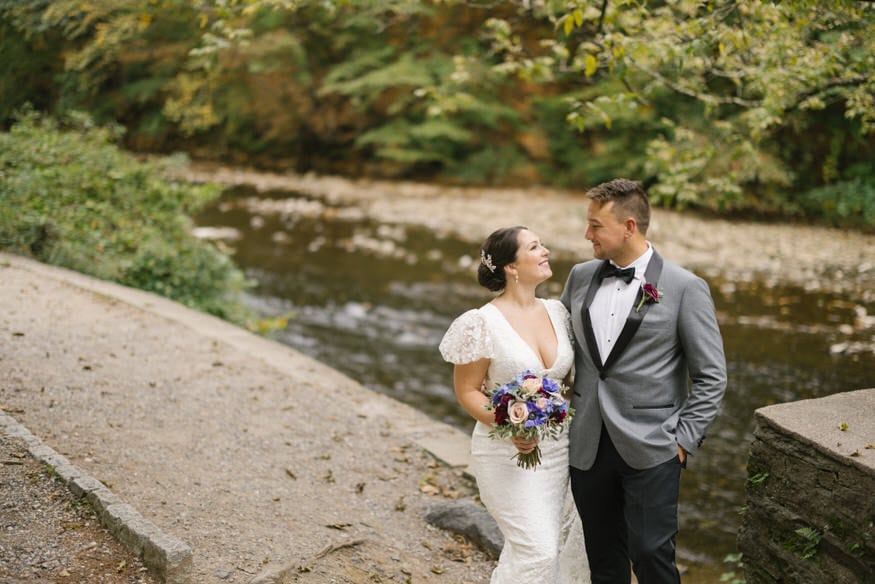 Couple walking Wissahickon trail Valley Green Inn wedding
