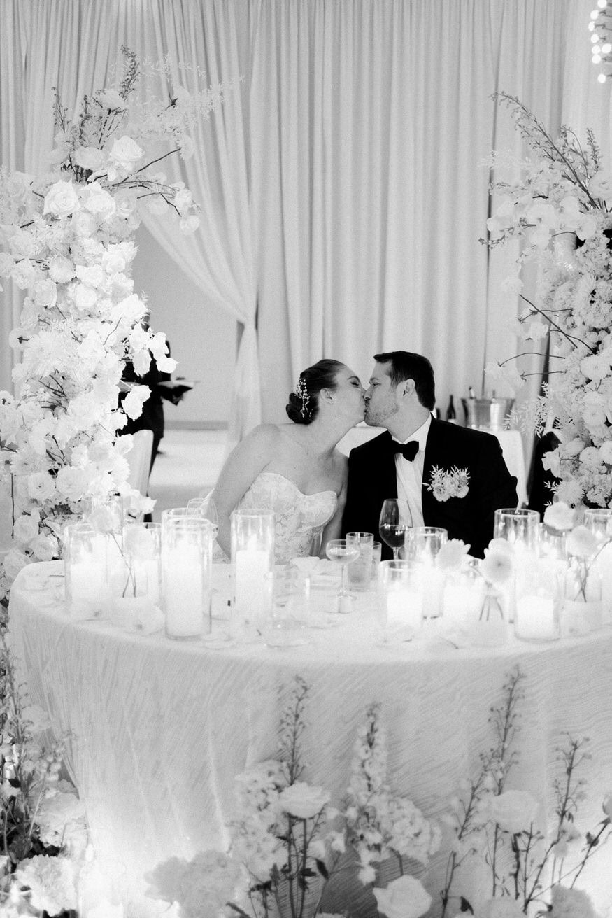 Couple toast kiss at Four Seasons Philadelphia wedding reception