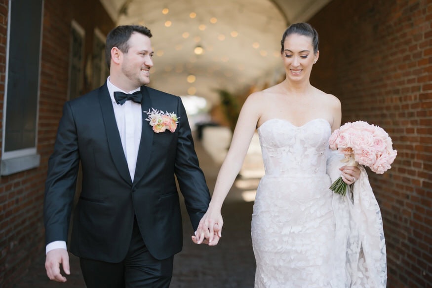 Couple walking together Four Seasons Philadelphia wedding day
