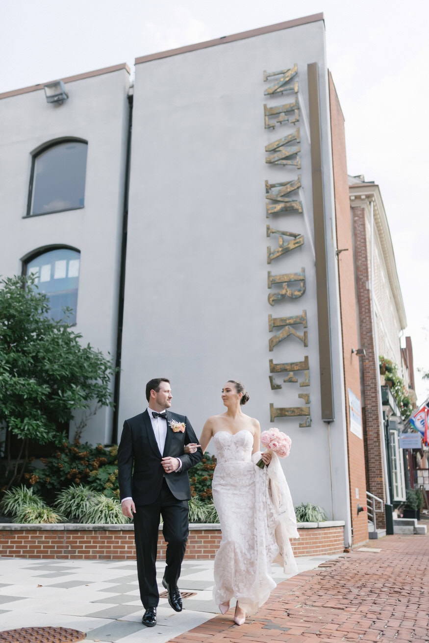 Bride and groom walking outside Four Seasons Philadelphia