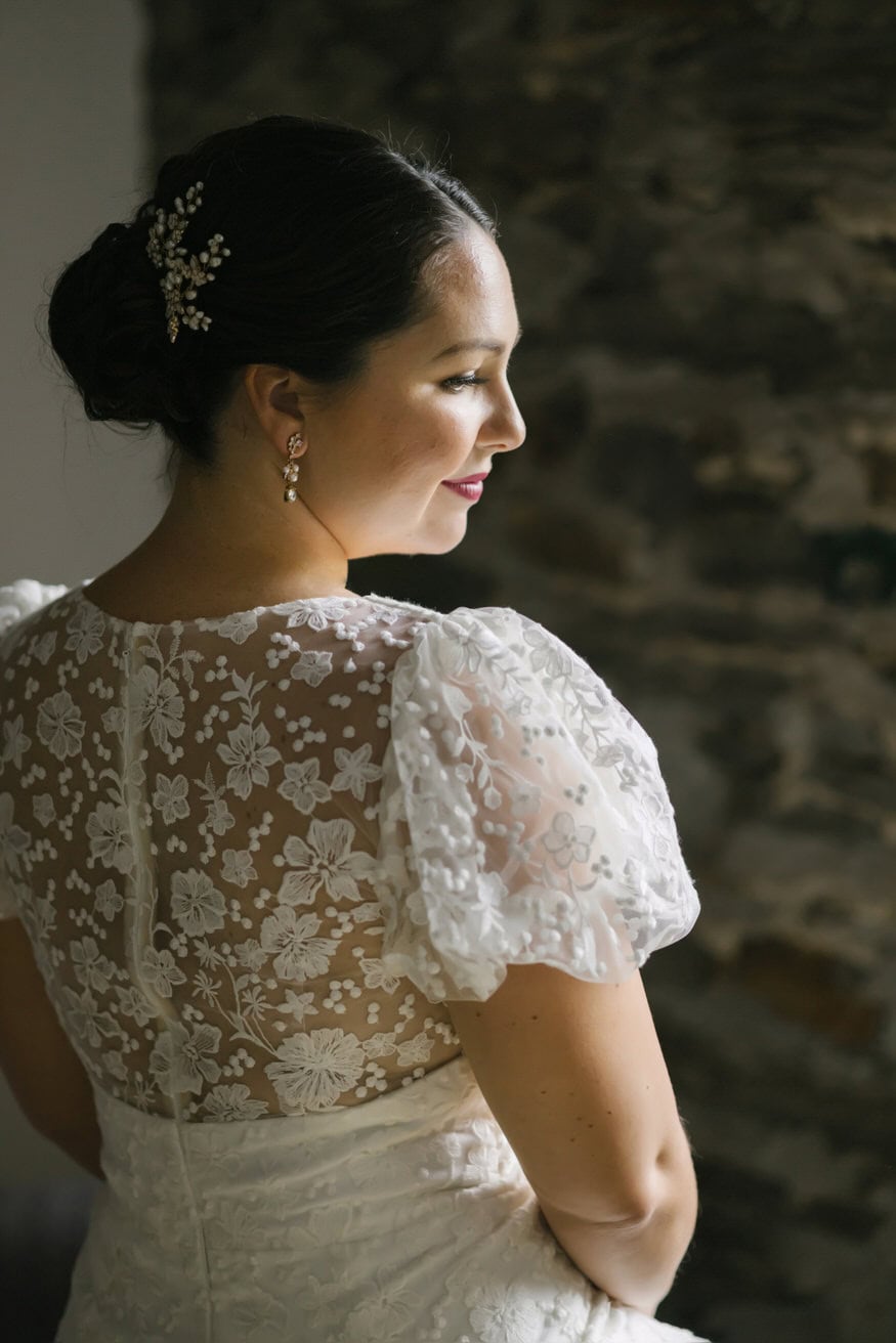 Bride putting on dress Valley Green Inn wedding day