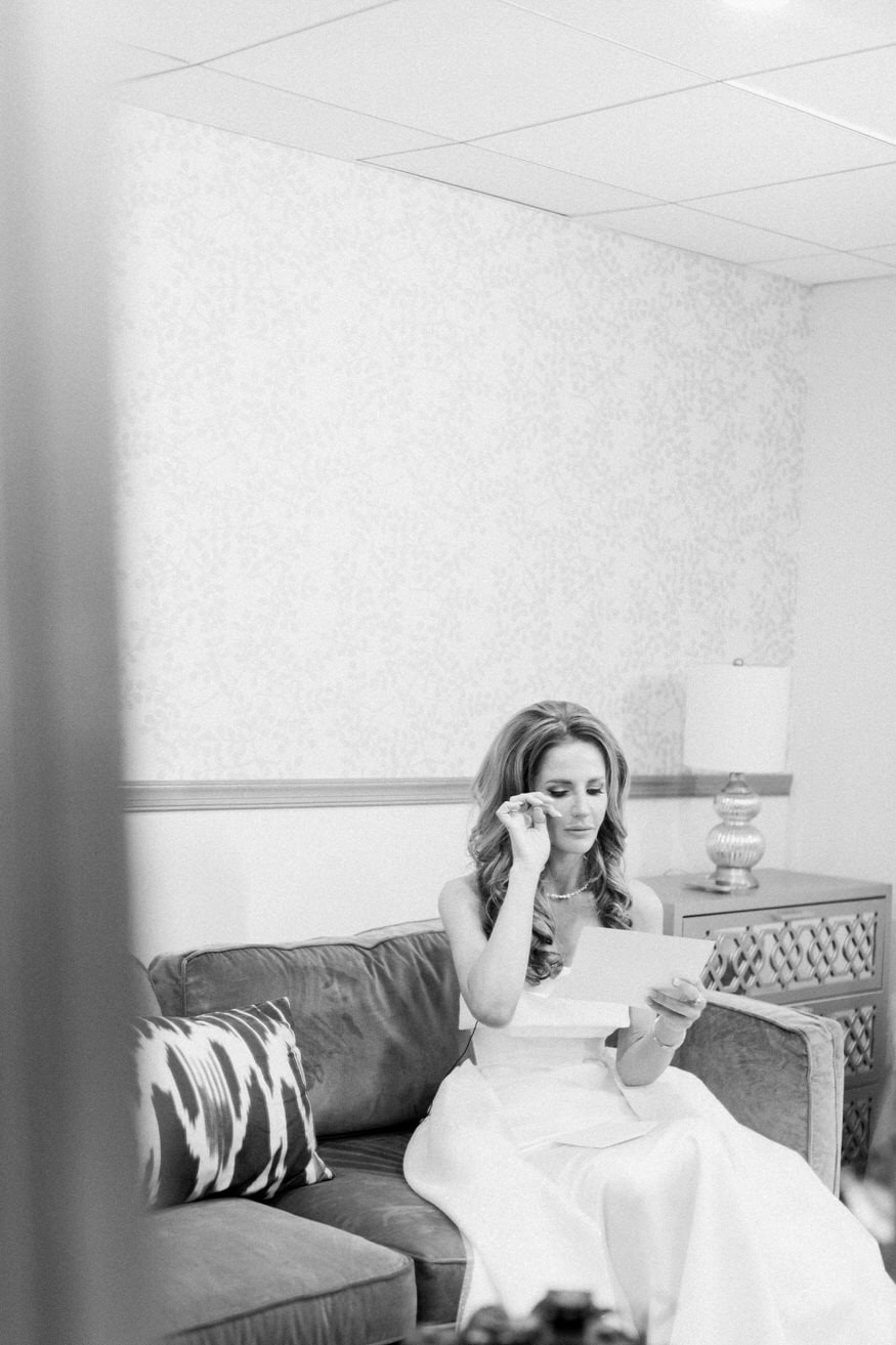 Bride reading emotional letter on wedding day Curtis Arboretum