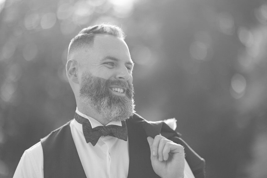 Groom solo portrait at Curtis Arboretum fall wedding Wyncote