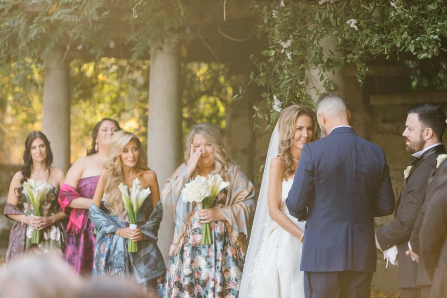 Bride and groom exchanging vows Curtis Arboretum wedding