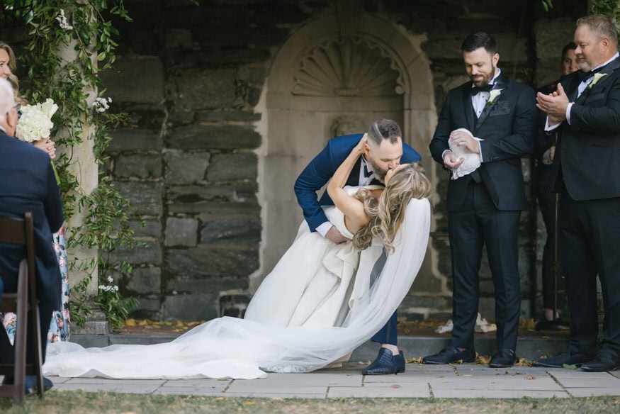 First kiss at Curtis Arboretum wedding ceremony Wyncote PA