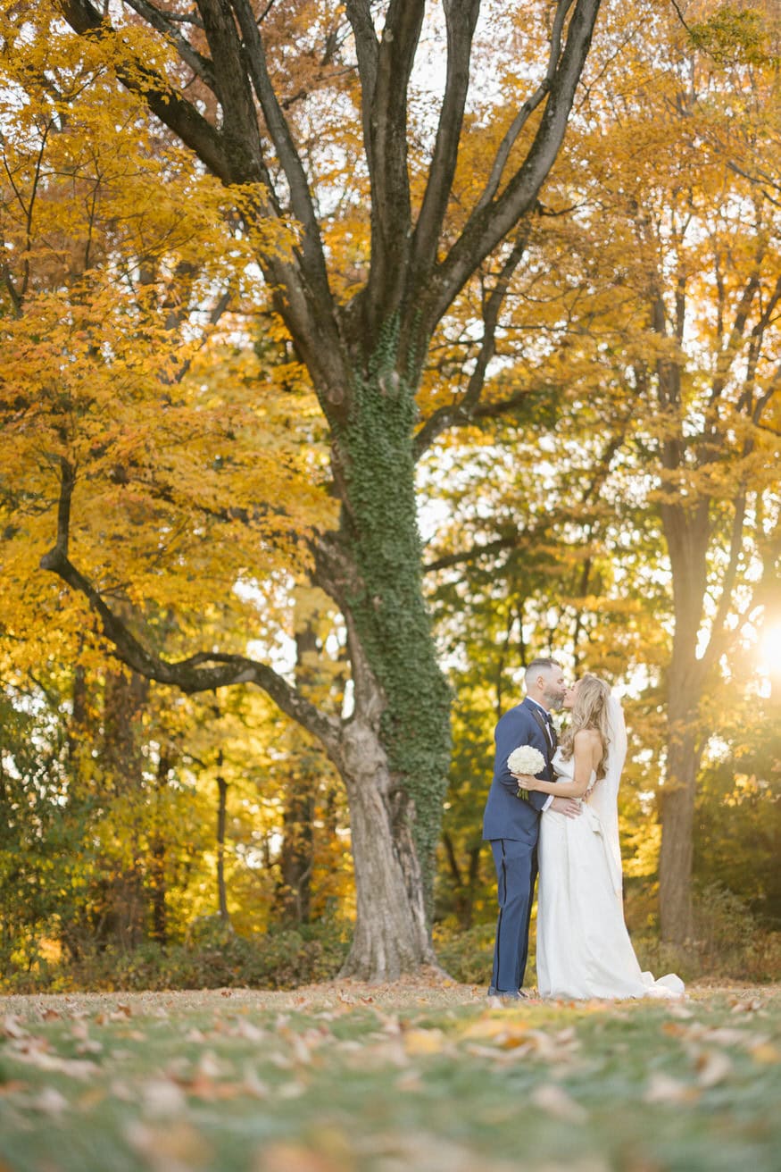 Bride and groom fall portrait at Curtis Arboretum Wyncote PA