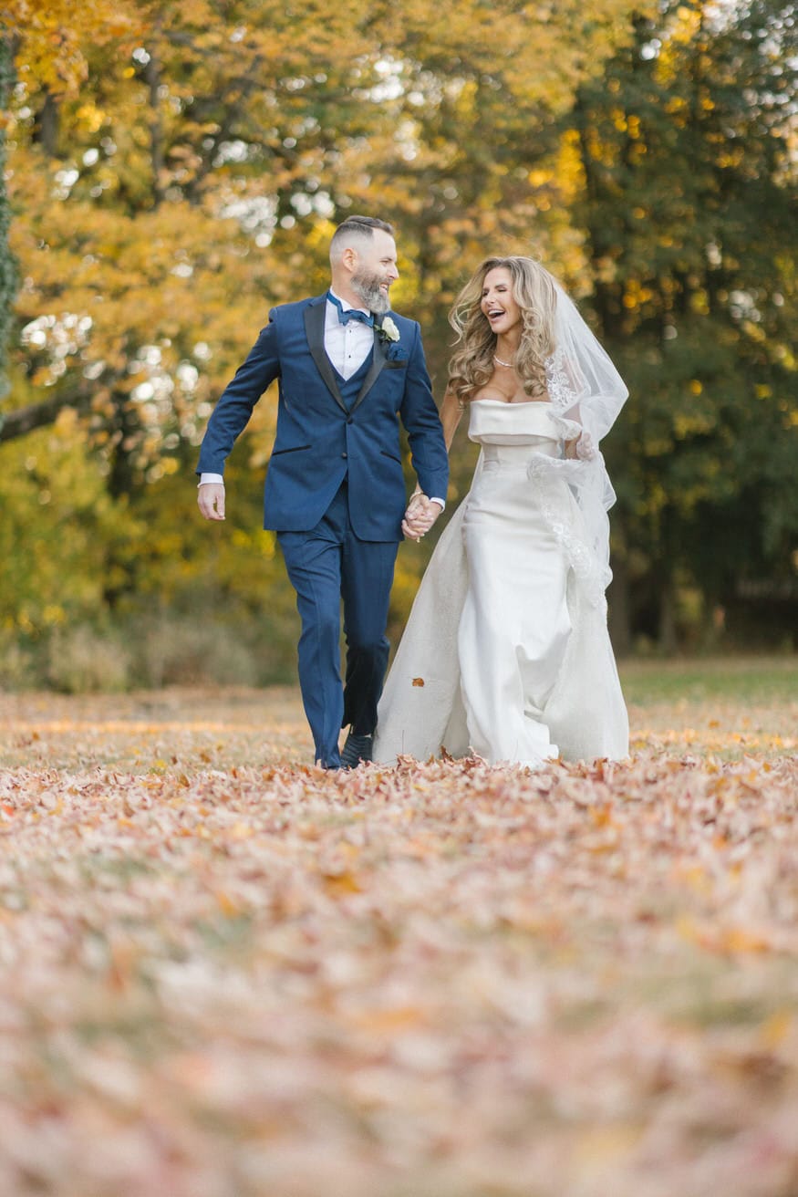 Bride and groom strolling Curtis Arboretum grounds Wyncote PA