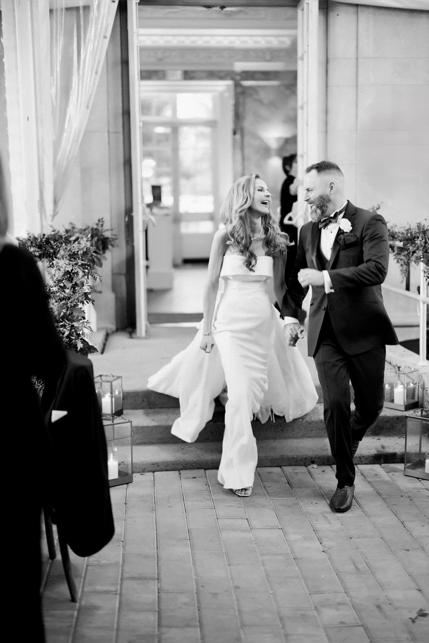 Bride and groom grand entrance at Curtis Arboretum reception