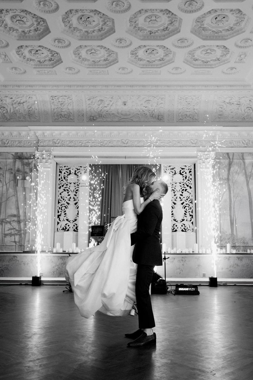 Groom lifts bride at Curtis Arboretum wedding reception