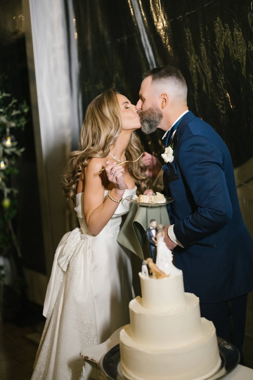 Cake cutting kiss at Curtis Arboretum fall wedding