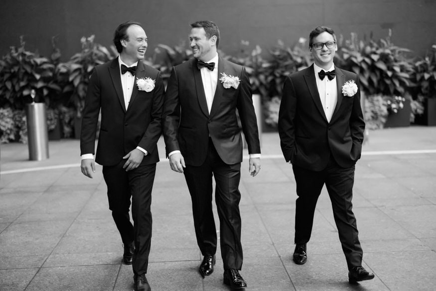 Groom and groomsmen walking Four Seasons Philadelphia