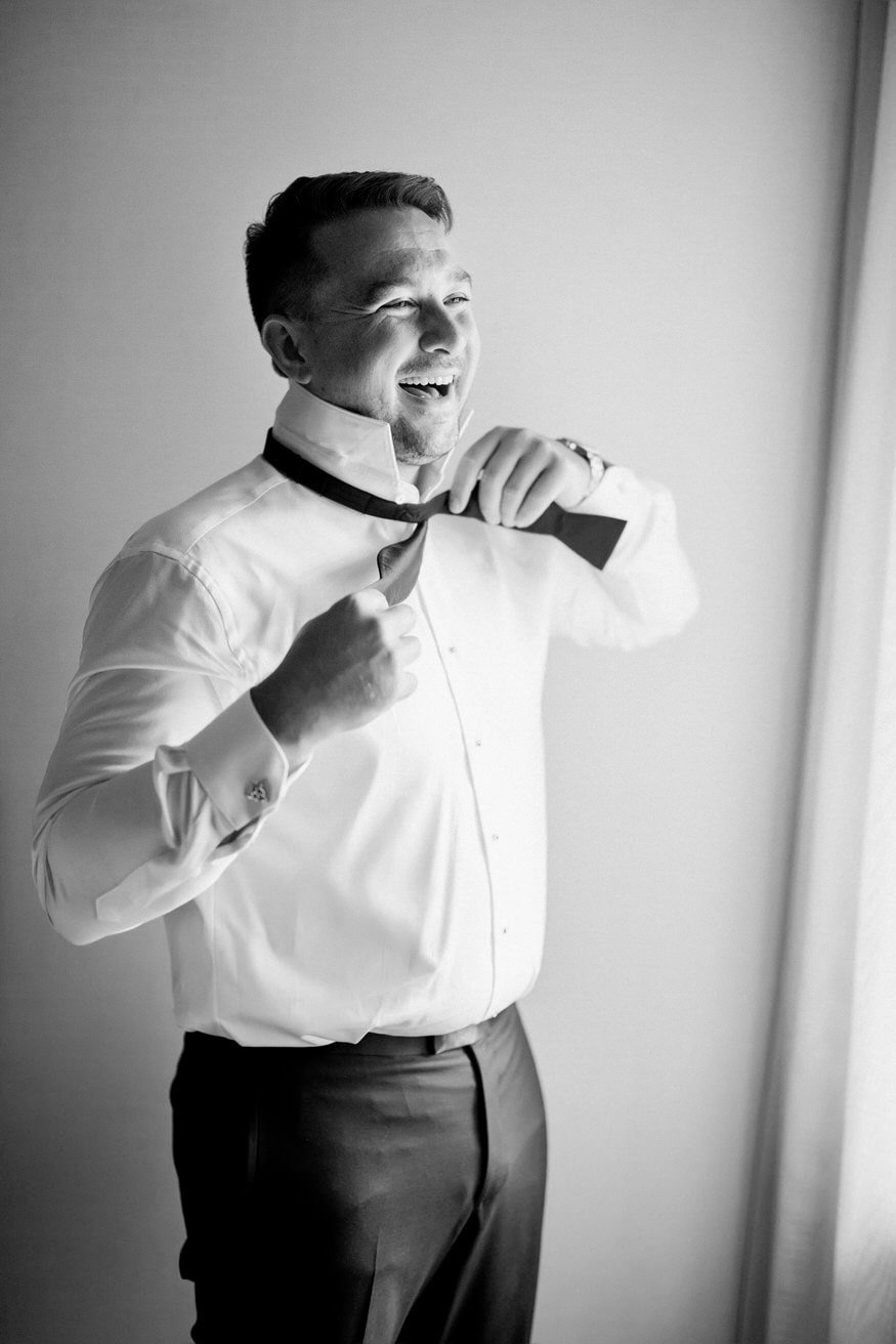 Groomsmen laughing during wedding prep Chestnut Hill Hotel