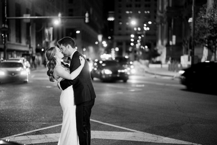 Romantic nighttime portrait couple Philadelphia City Hall