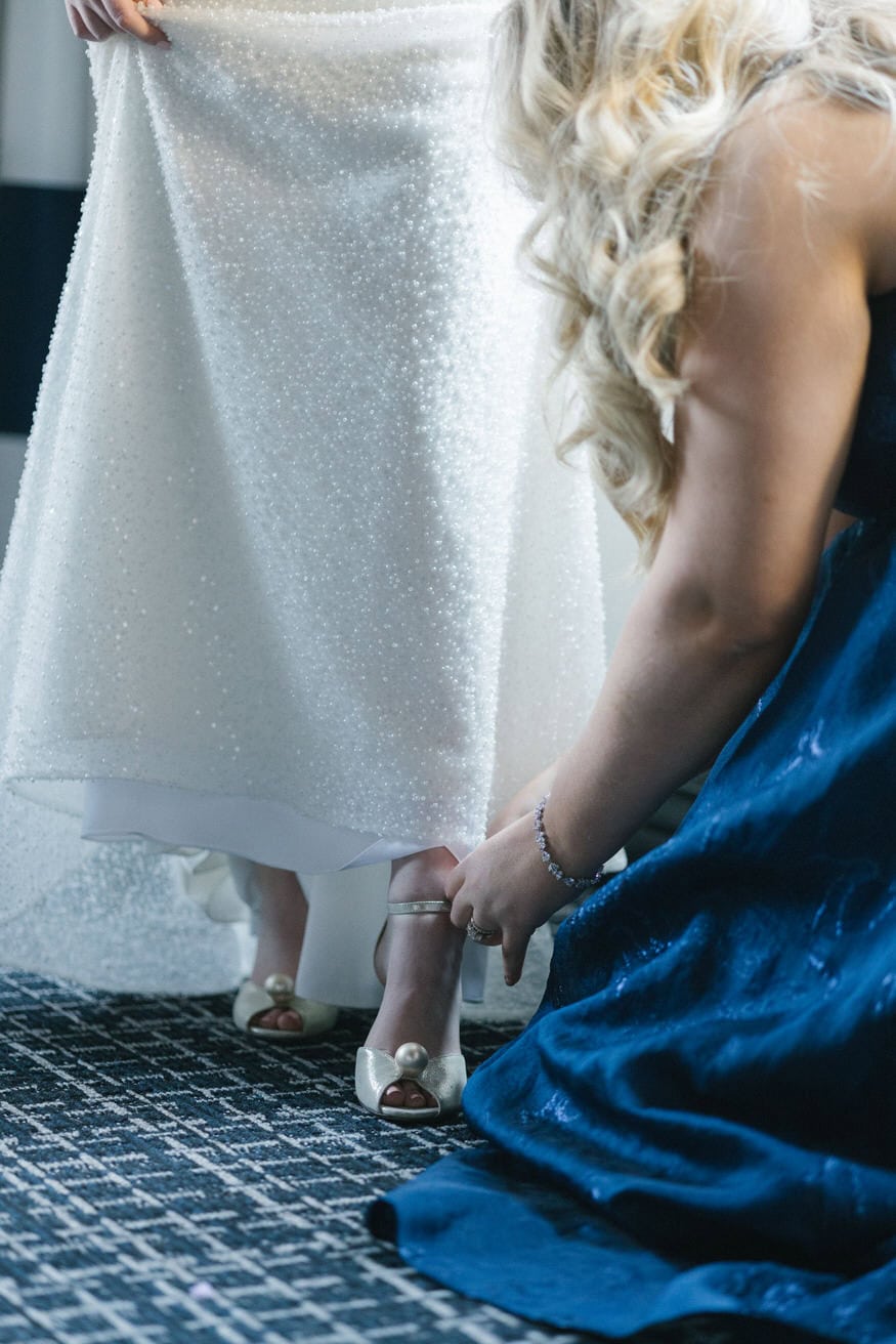Bride putting on dress at Notary Hotel Philadelphia