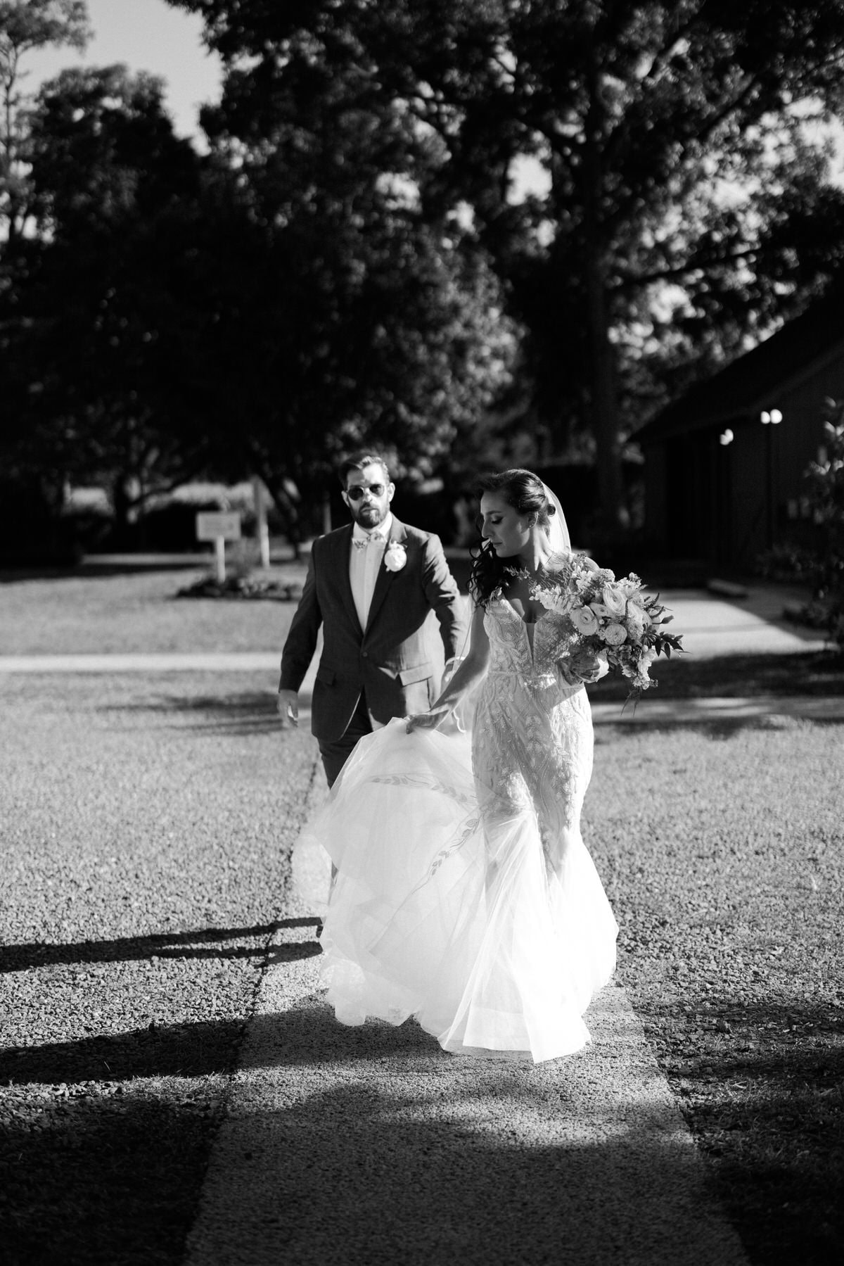 Bishop Farmstead Wedding couple walking on sidewalk
