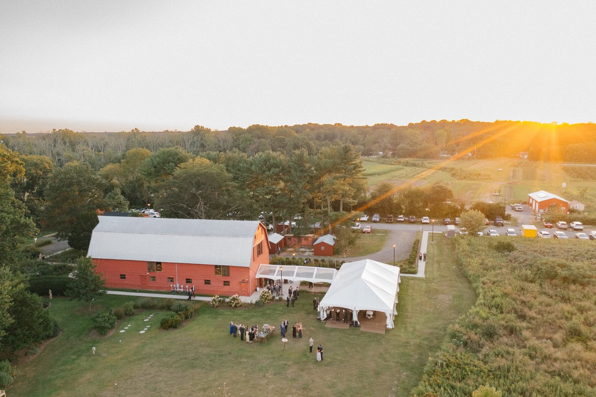 bishop farmstead wedding sunset drone view