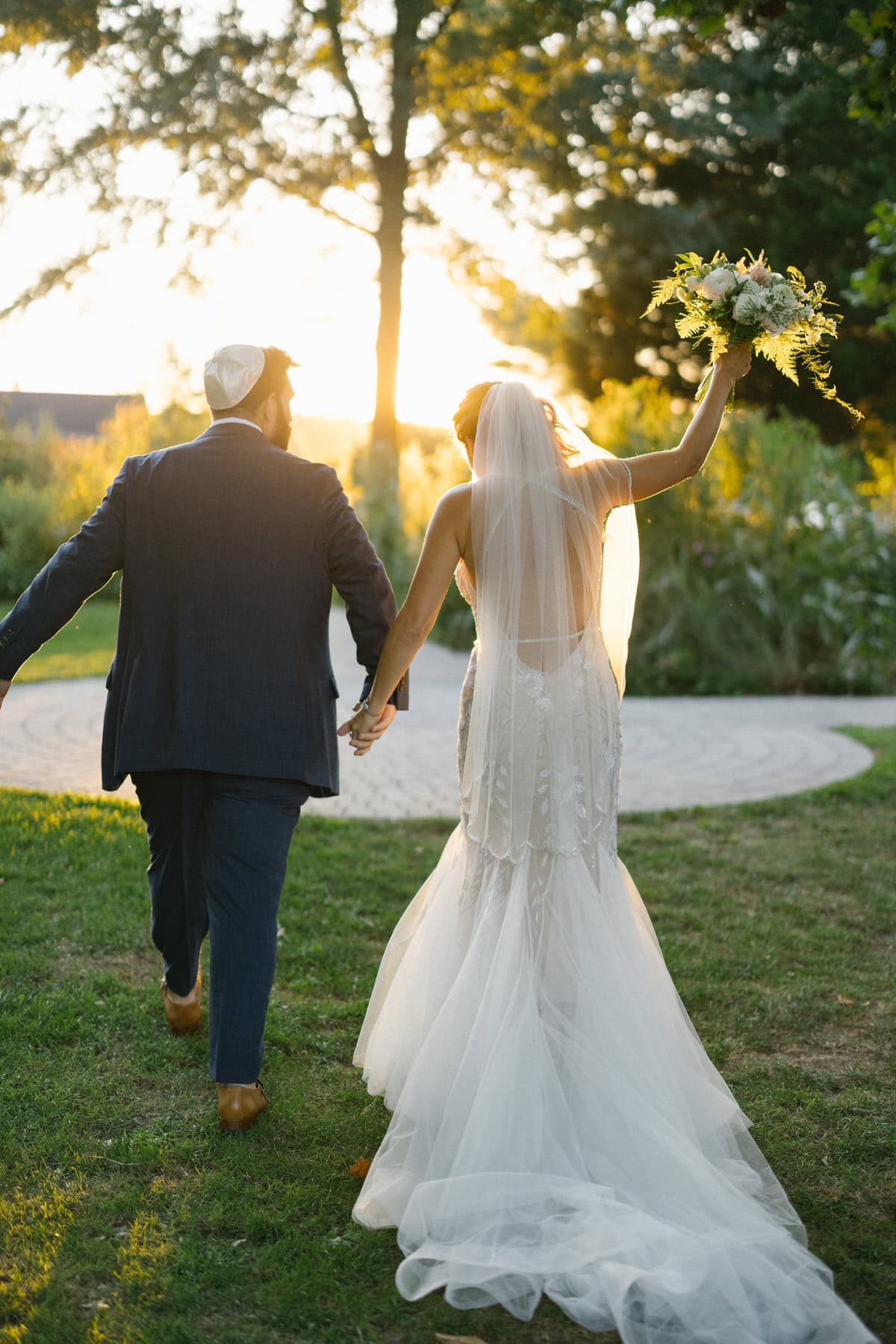 bishop farmstead wedding ceremony recessional walking into sunset 