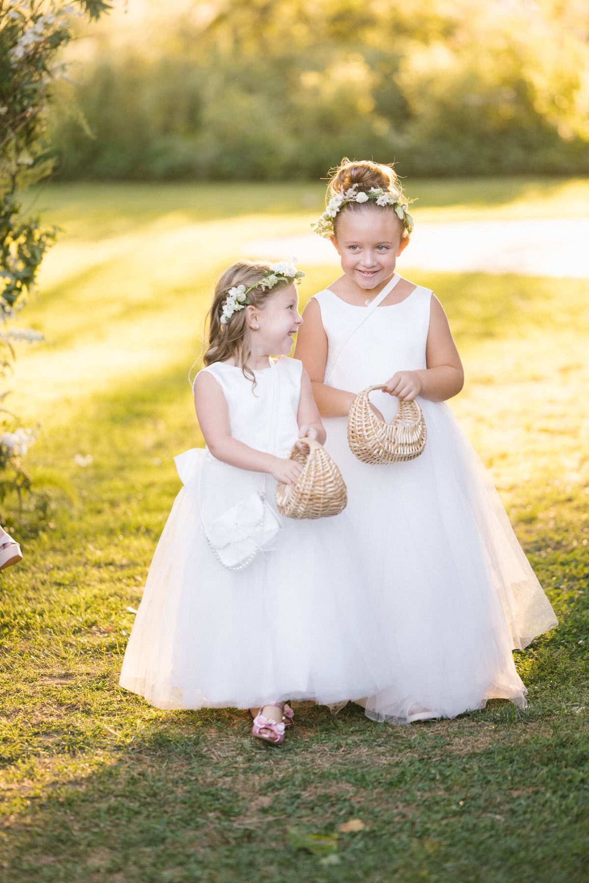 Bishop Farmstead Wedding ceremony flower girls coming down aisle