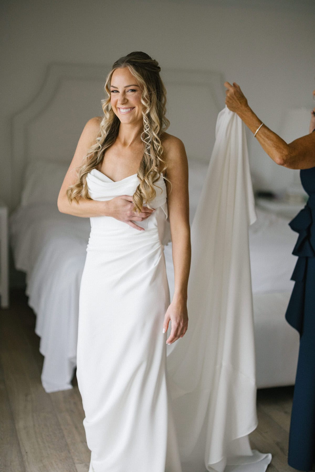 Bride finishing getting ready in an ocean-view suite at ICONA Avalon in Avalon NJ