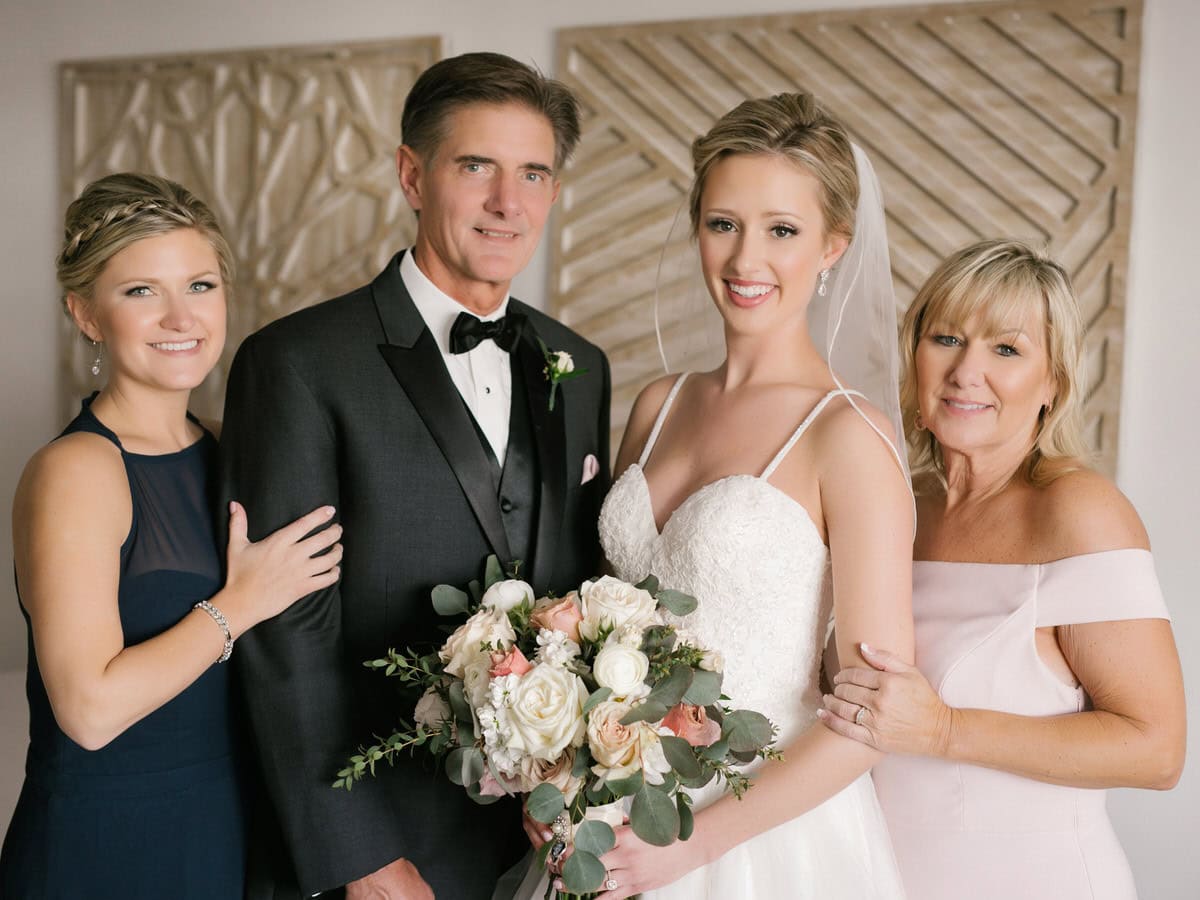 Family portrait inside the Aloha Suite at ICONA Avalon in Avalon NJ