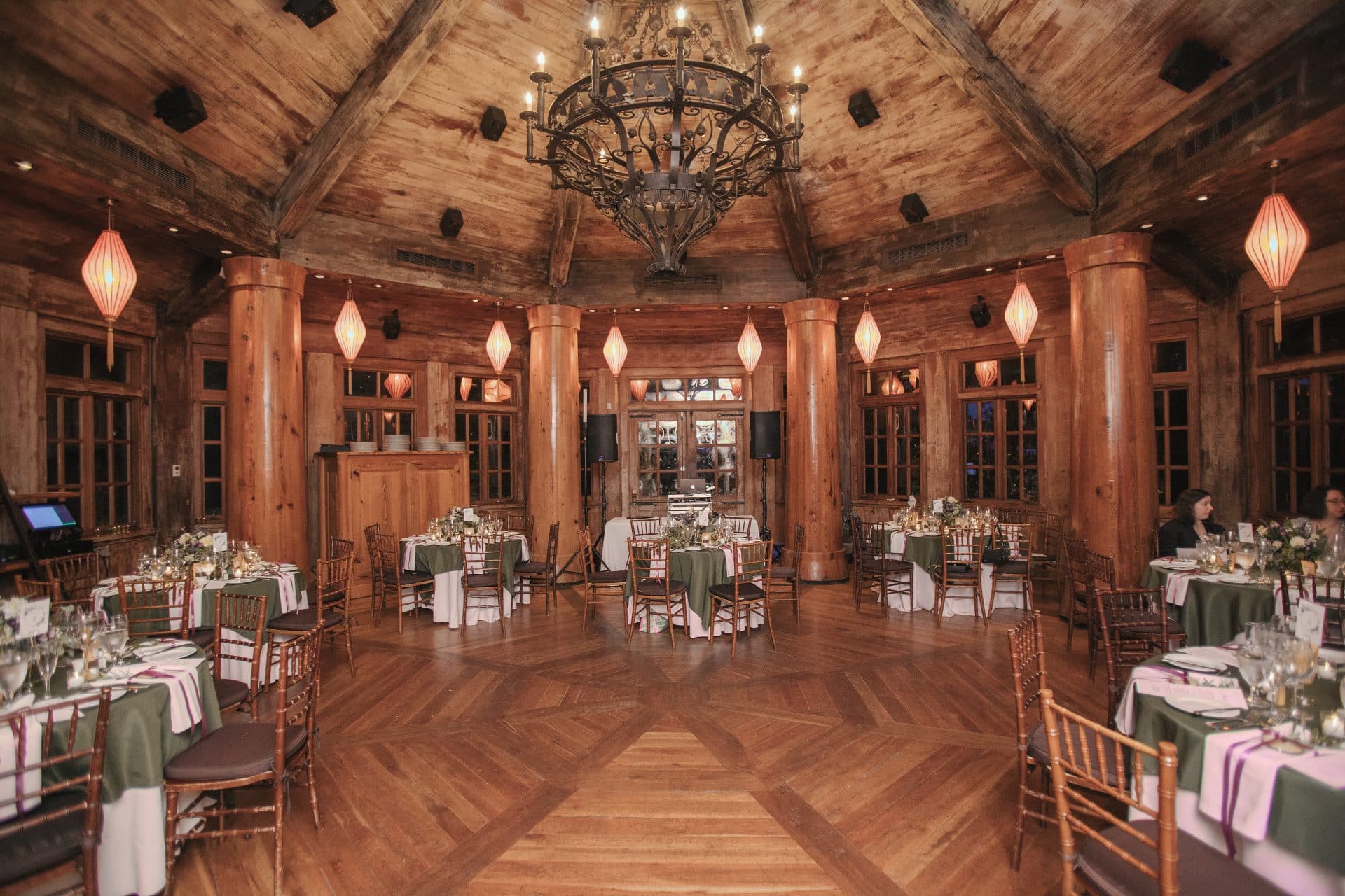 Inside Rat's Restaurant at Grounds for Sculpture, warm wood ceiling with chandelier and lanterns, Hamilton NJ wedding