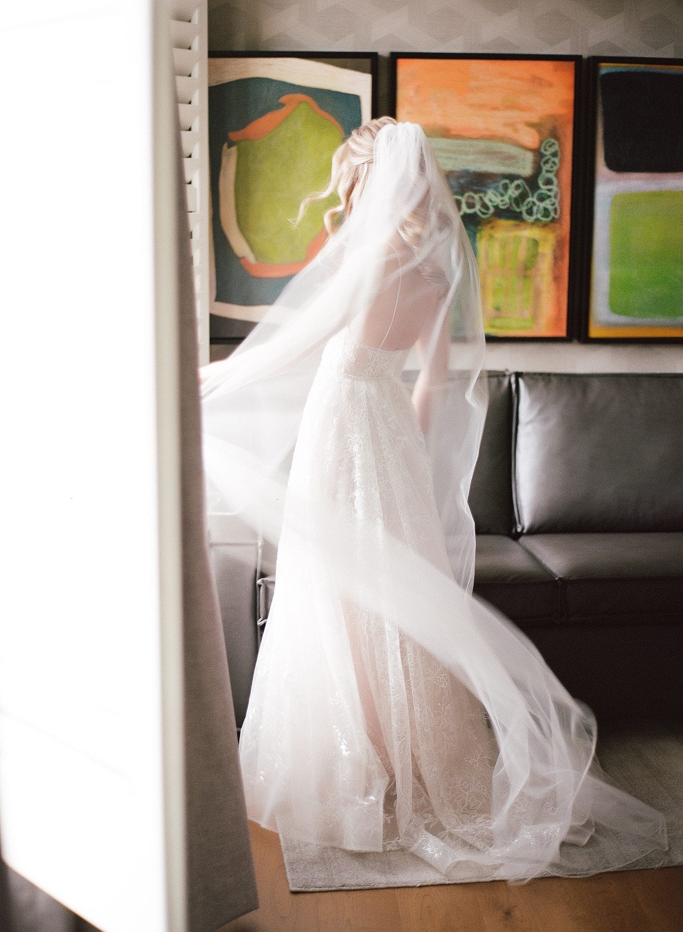 Bride with veil getting ready in the bridal suite at River House at Odette's in New Hope PA