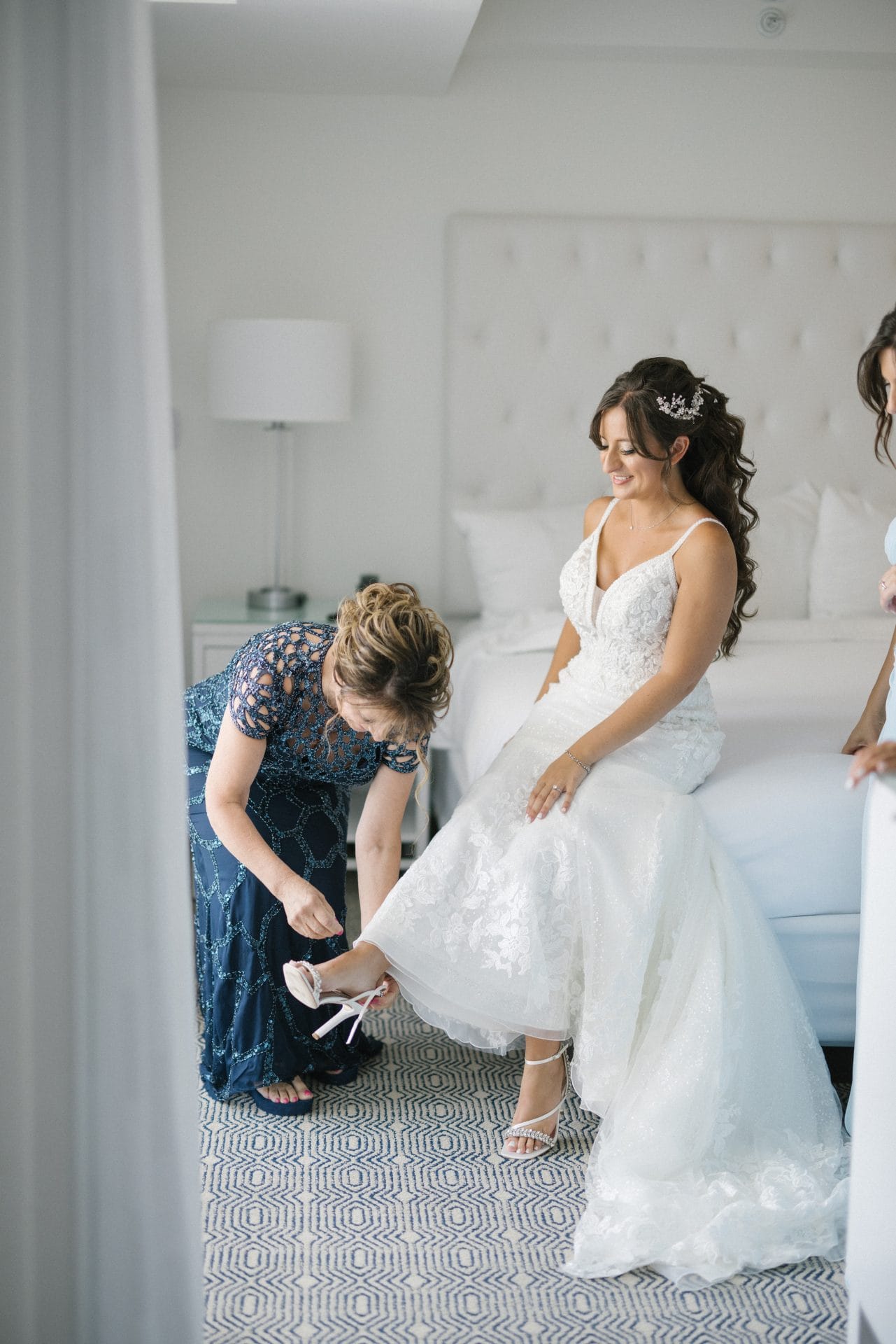 Bride getting ready in a hotel suite with bridesmaids at ICONA Diamond Beach Wildwood NJ